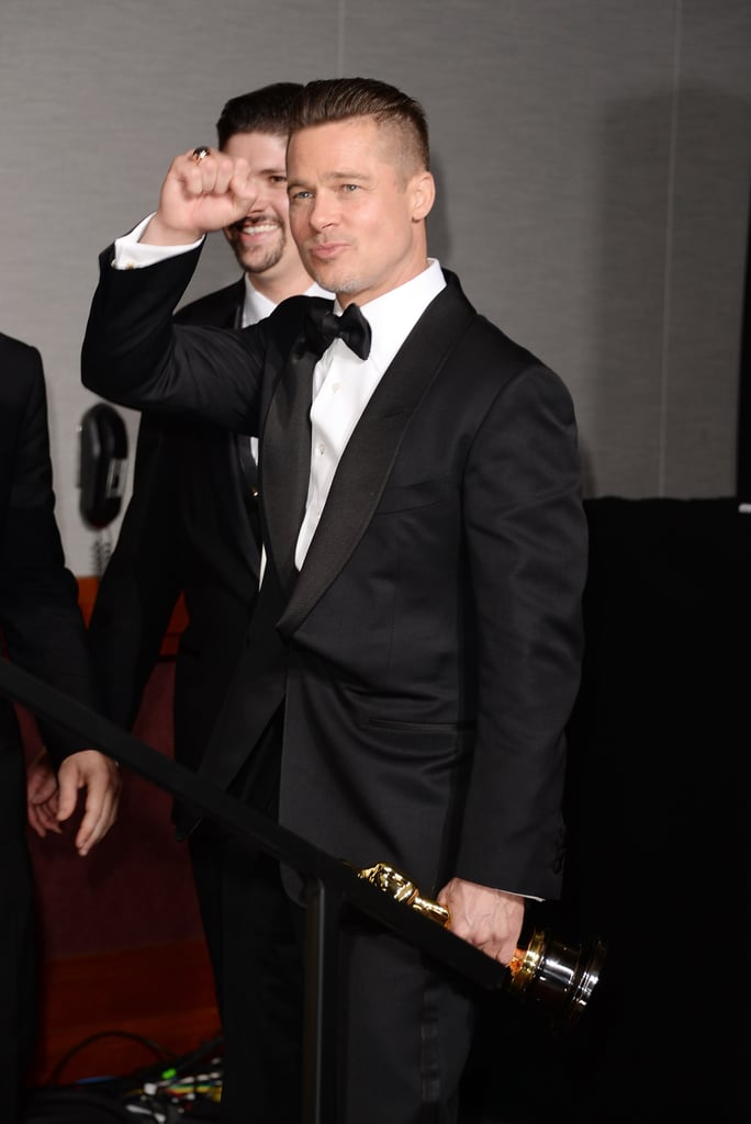 Brad Pitt fist-pumped after winning his first Oscar ever for producing 12 Years a Slave.