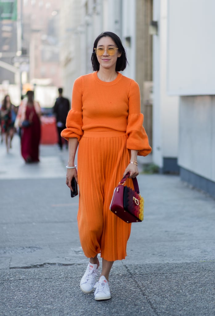 Eva Chen went for it at New York Fashion Week by wearing head-to-toe orange. Going monochrome is one of the easiest ways to rock the trend without worrying about what matches what.