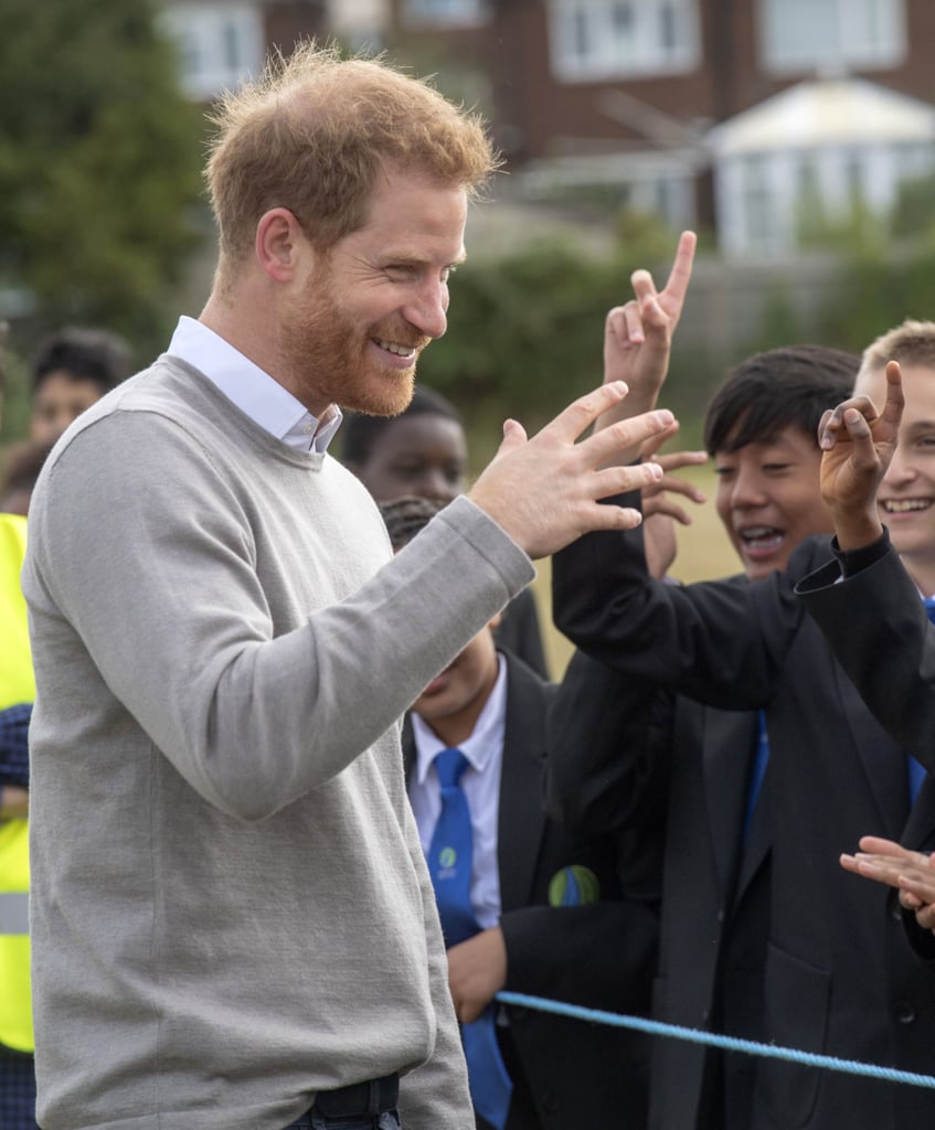 Prince Harry Hugs Kids at Lealands High School