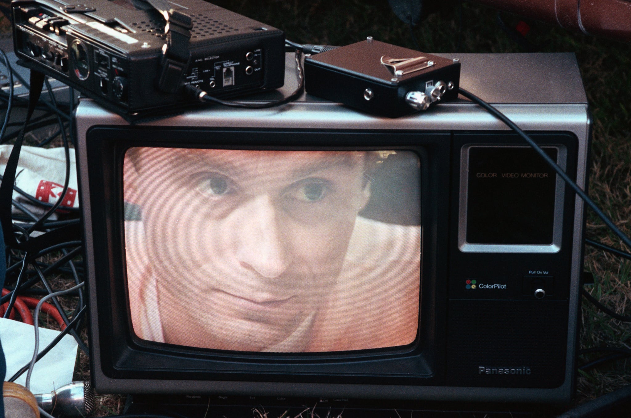 Ted Bundy's image on a television screen on the lawn of the Florida State Prison. | Location: Starke, Florida, USA.