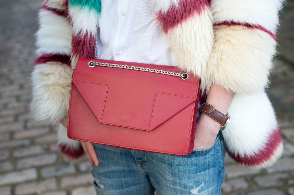 How do you turn up the cool factor on jeans and a white shirt? With a colored fur and bright bag, of course.