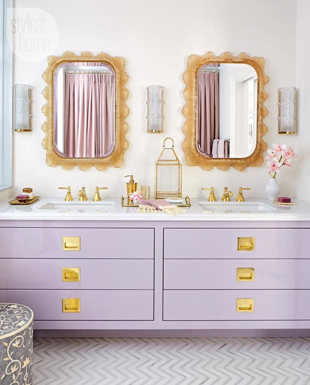 The purple and gold of this bathroom match her family's royal sigil.
