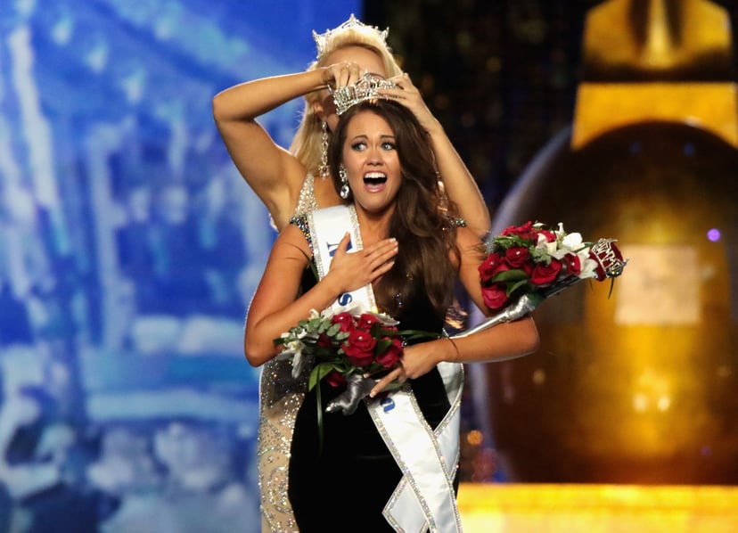 ATLANTIC CITY, NJ - SEPTEMBER 10:  Miss North Dakota 2017 Cara Mund is crowned as Miss America 2018 by Miss America 2017 Savvy Shields during the 2018 Miss America Competition Show at Boardwalk Hall Arena on September 10, 2017 in Atlantic City, New Jersey