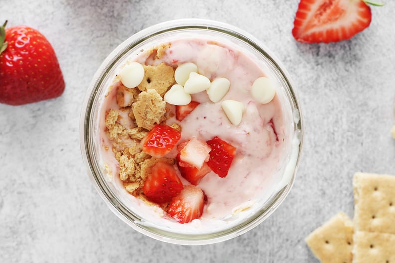 Strawberries, graham crackers, and white chocolate chips in strawberry cheesecake ice cream