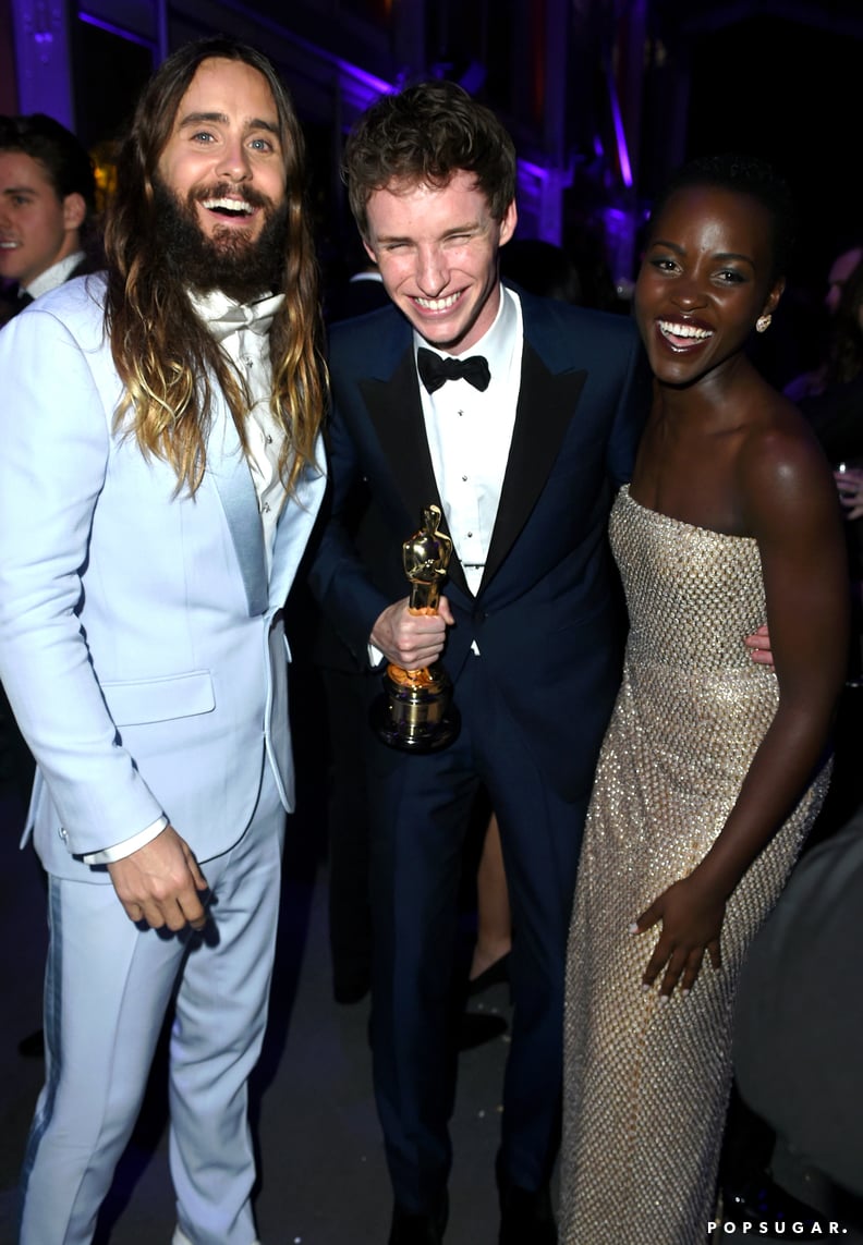 Jared and Lupita actually thought putting Eddie Redmayne between them would make us forget how in love they looked.