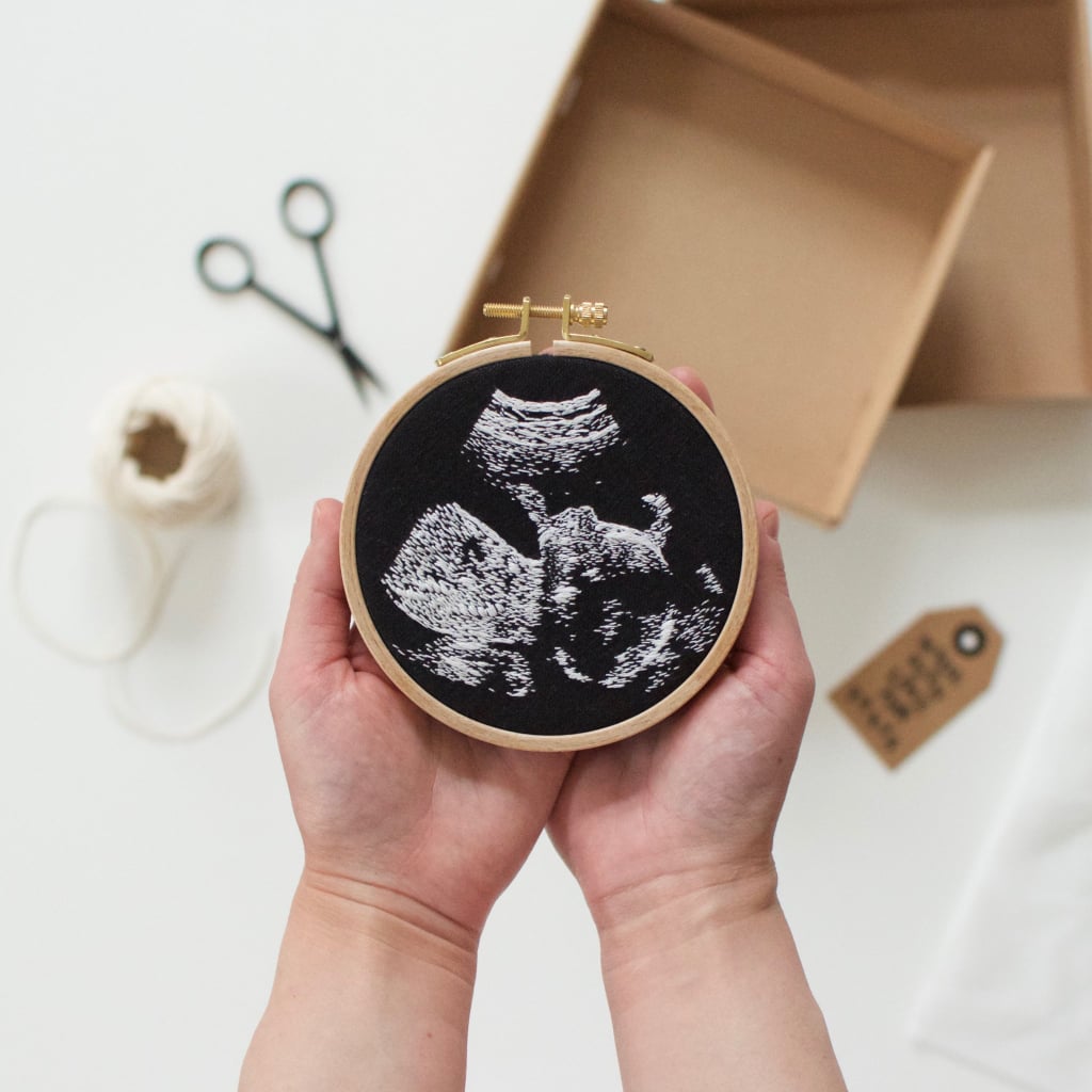 When she was pregnant, Veselka Bulkan started to channel her creative energy and talents as an embroidery artist into something to remember this season of her life: her daughter's ultrasound photo, embroidered onto black fabric, which she also used as a way to announce her pregnancy to her followers on her Instagram account, @catchtheinspiration. The gorgeous and realistic embroidery sparked an influx of requests from her followers who also had their child's ultrasound photo just lying around, and she now has a list of people waiting to commission her for their own unique piece of art. 
When we first connected with her, Veselka was working while caring for her newborn to get the growing orders ready for her customers — which can each take anywhere from a couple of weeks to a month or more and cost $300 apiece. "My husband and I never thought that the waiting list would be so long in the end," Veselka told POPSUGAR. "I have been able to do only a few up to now but am speeding up."

    Related:

            
            
                                    
                            

            This Is the Coolest Thing You Can Do With Your Baby&apos;s Old Onesies
        
    
As for what goes into creating these stunning, time-consuming crafts, there's a surprising amount. Because ultrasound photos aren't always consistent, and the baby can really be in any position during the mom's sonogram appointment, Veselka can only work with certain ultrasounds successfully.
"The posture of the baby is a factor. Some photos are close up to the face, some are not. The contours on the head are pretty different in each in terms of abstraction of details. The textures of the scan and the ratio of black and white areas are also a difficulty factor," she said. "Some of the ultrasounds are so blurred and abstract. Their textures are not so clear so that the result would not be good at all. Three-dimensional ultrasounds are also not applicable."
As of now, Veselka is working through a backlog of orders, but if you'd like to try to hop on Veselka's next waiting list to have a custom keepsake of your own, you can send her an email with your own ultrasound photo attached so she can determine if it's viable for an embroidery. Or, for $38, you can learn how to make your own ultrasound embroidery with Veselka's handy tutorial, which you can purchase on Etsy.

    Related:

            
            
                                    
                            

            Everything You Need to Know About Those “Tree of Life” Photos That Keep Going Viral