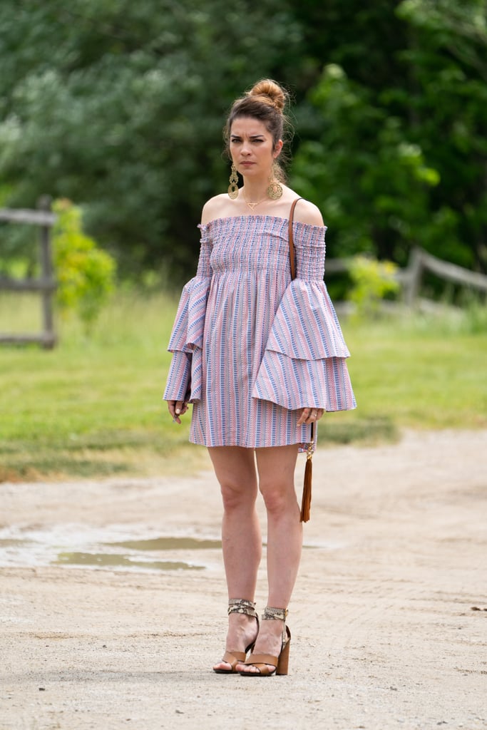 Alexis knows that an off-the-shoulder neckline is a perfect opportunity to show off a pair of major earrings.