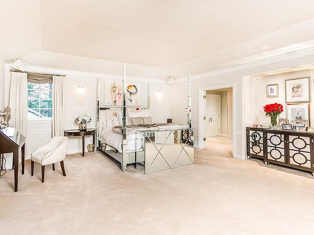 To capture the midcentury look Dorothy Draper was known for, Michelle swapped white lacquered furniture (great in some settings, but not a perfect fit for Jennifer) with glamorous mirrored furniture, like this bedroom set.