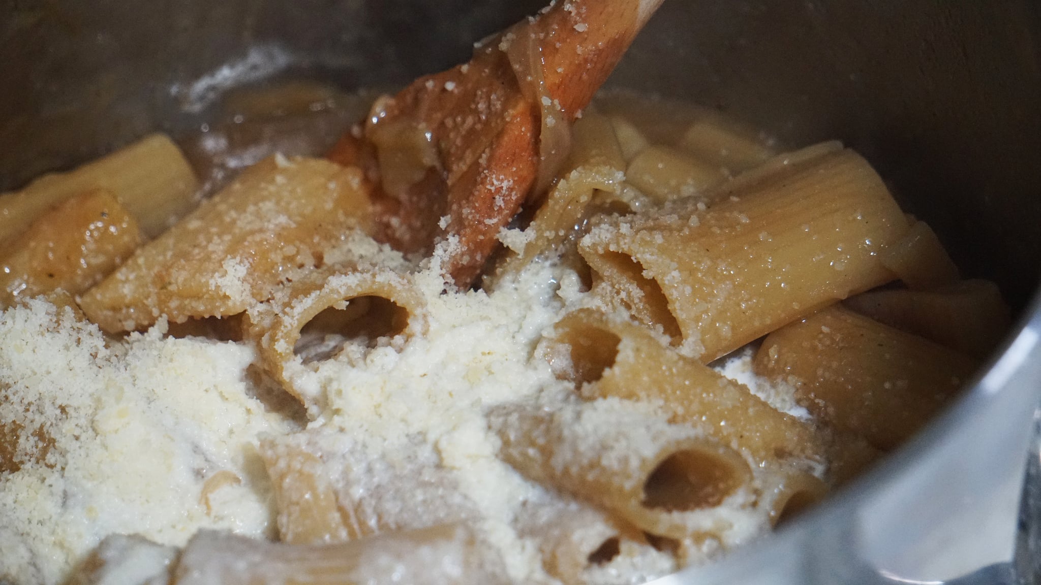 stirring cheese into french onion pasta recipe