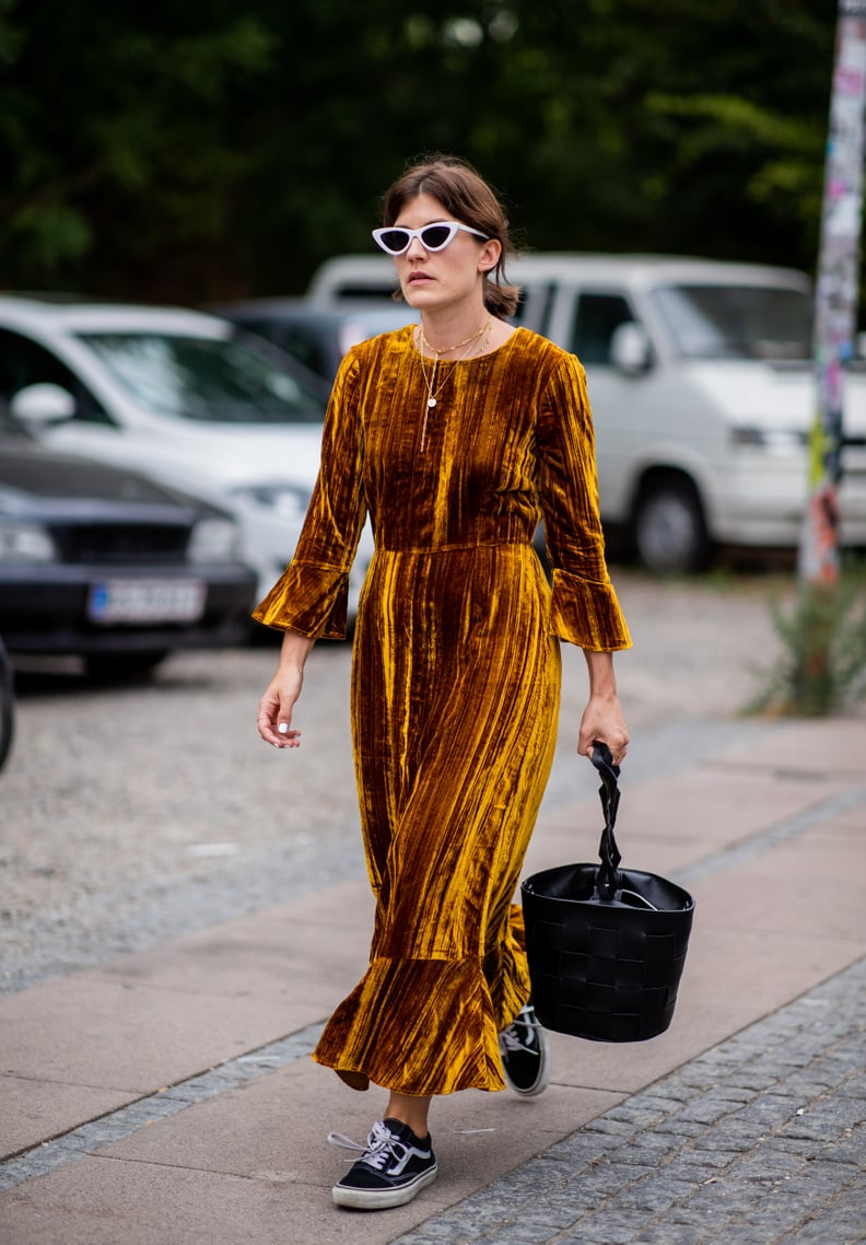 With a Velvet Dress, Circular Bag, and Cat-Eye Sunglasses