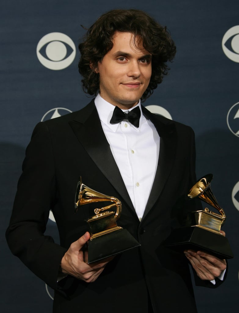 John Mayer happily posed with his trophies in the press room.
