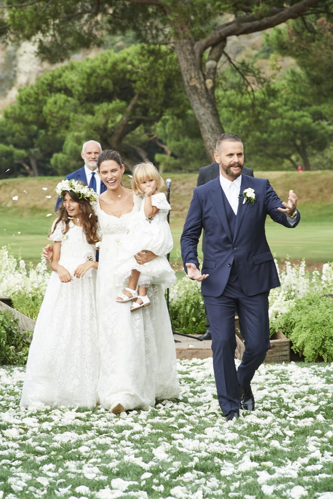 The Embroidered Design Stood Out Against Her Family's Outfits
