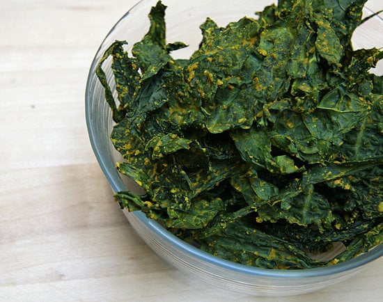 Once you pick up nutiritional yeast at your local health food store, it's time to get creative in the kitchen. Check out some our favorite ways to sprinkle it on.

Curried kale chips: After falling hard for the Bombay Curry flavor of Rhythm Superfoods kale chips, we couldn't wait to create a homemade version. These curry kale chips make use of nutritional yeast and are also high in fiber and iron.
Mac and "cheese": Vegan eaters who have missed the comfort of classic mac will find a new favorite in this mac and "cheese". In this tasty recipe, nutritional yeast, Smart Balance spread, and veggie broth come together for a creamy, decadent-tasting sauce.
Dressed-up popcorn: The low-calorie and low-fat snacking staple is essential for any Oscars spread — as long as you skip the butter. Shake on nutritional yeast generously on top for a fresh take on the favorite.

Photo: Michele Foley