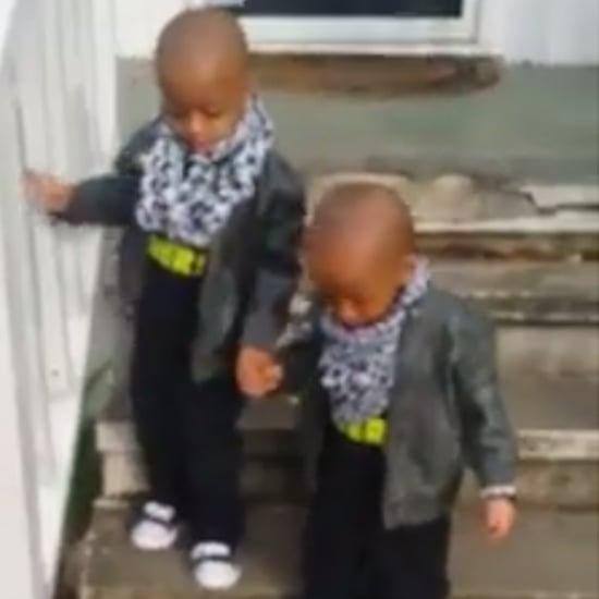 Twin Brothers Help Each Other Walk Down Stairs