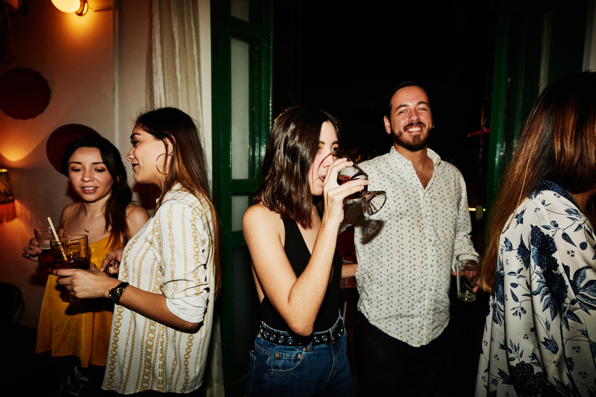 woman drinking wine at a singles event