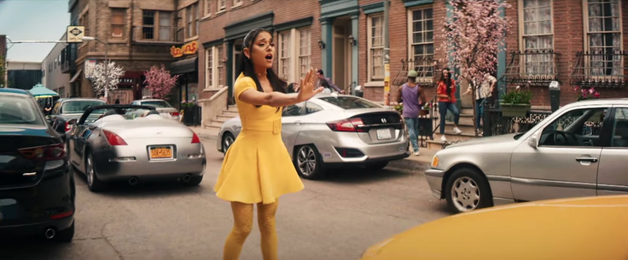 The Versace yellow ensemble with short dress, tights, platform sandals worn  by Ariana Grande in the clip No Lockdowns Anymore w / Ariana Grande &  Marissa Jaret Winokur