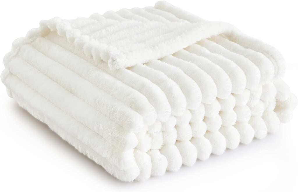 Bedsure White Throw Blanket ($12, originally $16)
There's nothing better than curling up in this cozy Amazon throw after a long day at work. The TikTok-viral plush blanket comes in a variety of sizes and colors based on your decor needs — and it makes the perfect self-care gift.