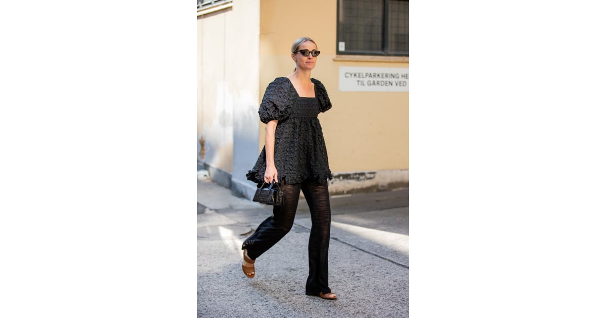 Pairing a puffsleeve minidress with trousers offers a more modest and