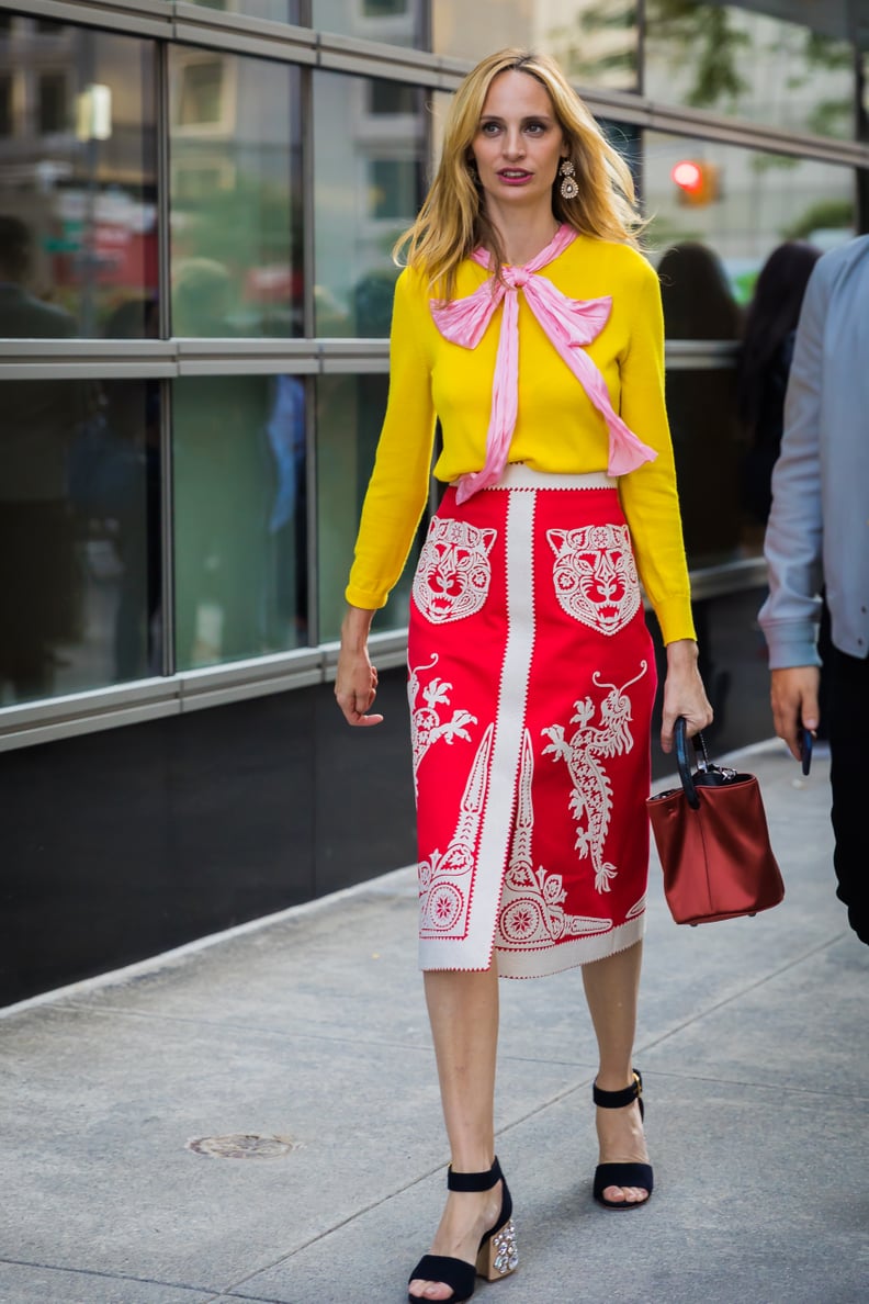 Tuck a Mustard Yellow Blouse Into a Printed Skirt