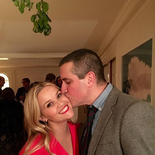 Jim Toth planted a sweet kiss on Reese Witherspoon under the mistletoe.
