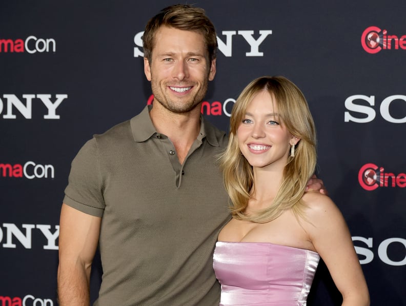 LAS VEGAS, NEVADA - APRIL 24: (L-R) Glen Powell and Sydney Sweeney pose for photos as they promote the upcoming film 