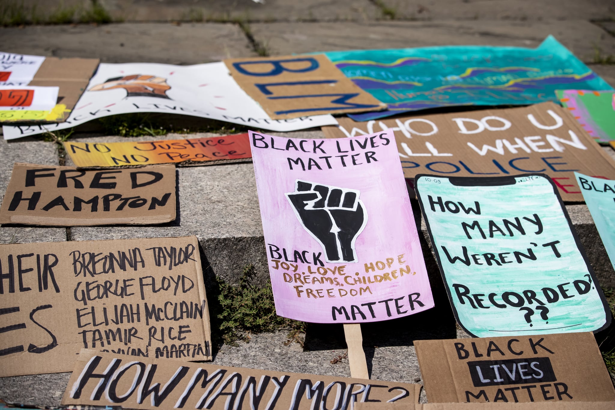 BROOKLYN, NY - July 25: A line of homemade protest signs lay on the steps for people to pick up and use for the march in Cadman Plaza, Brooklyn.  This non-violent protest organized by Unite NY which included thousands of protesters that marched across the Brooklyn Bridge was meant as a statement that the protesters in New York stand in solidarity with in Portland, OR and against federal invasions and in support of Black Lives Matter.  Portland has seen federal agents have taken protesters and put into unmarked vehicles while others have been beaten and pepper sprayed.  This was billed as a 
