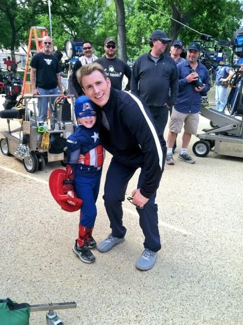 Chris Evans took time from filming Captain America: The Winter Soldier in 2013 to pose with a little boy dressed as Captain America on set.