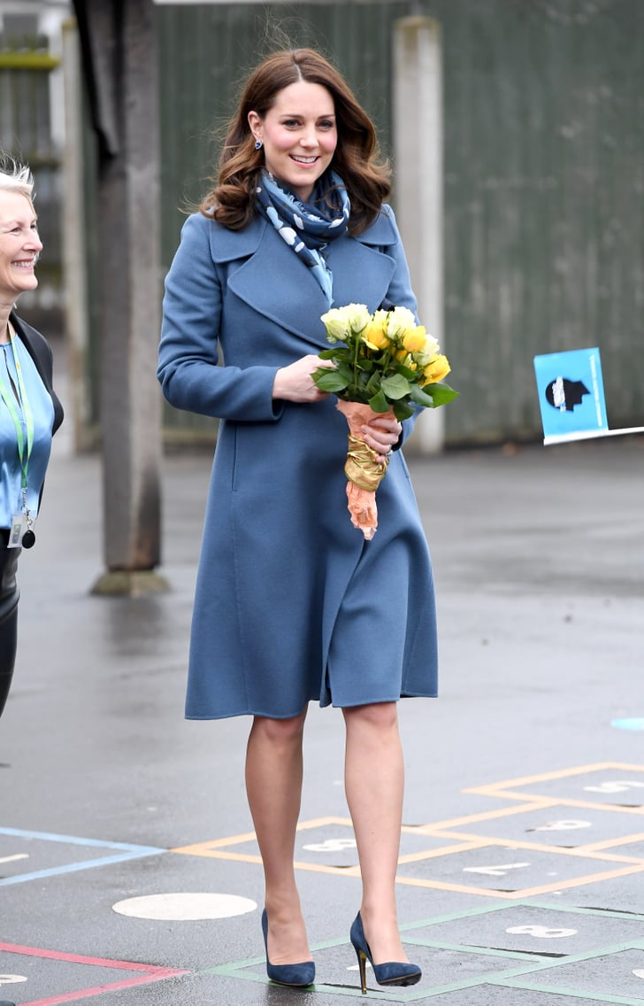 During a visit to the Roe Green Junior School, Kate wore a blue | Kate ...