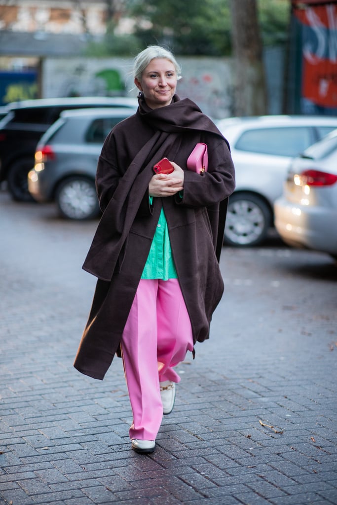 A dark-brown coat, instead of black, adds a softer contrast to a turquoise-and-pink outfit.