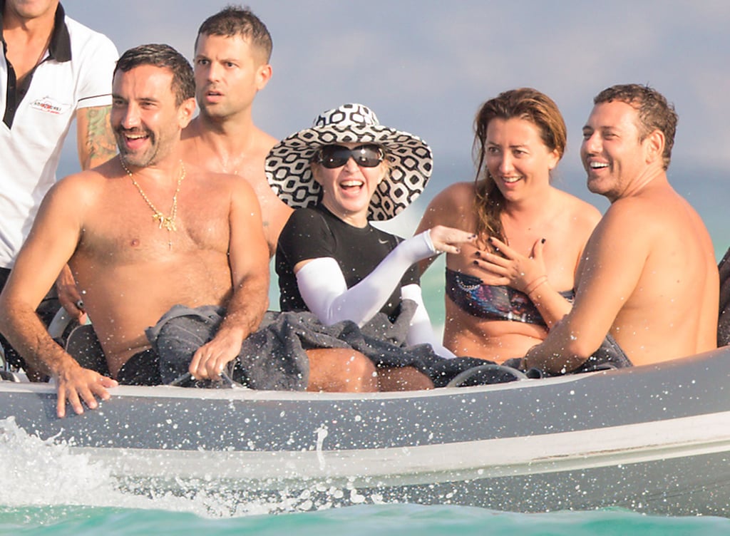 Madonna was surrounded by tan friends on the open water in Formentera, Spain, on Tuesday.