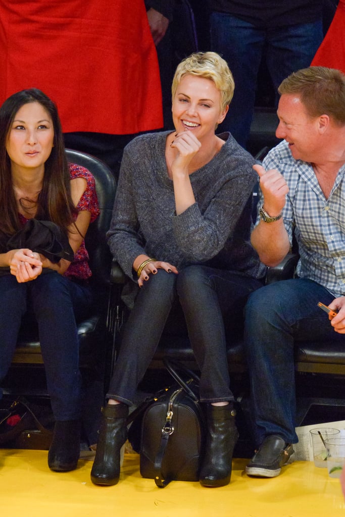 Charlize Theron chuckled with friends at an LA Lakers game in April.