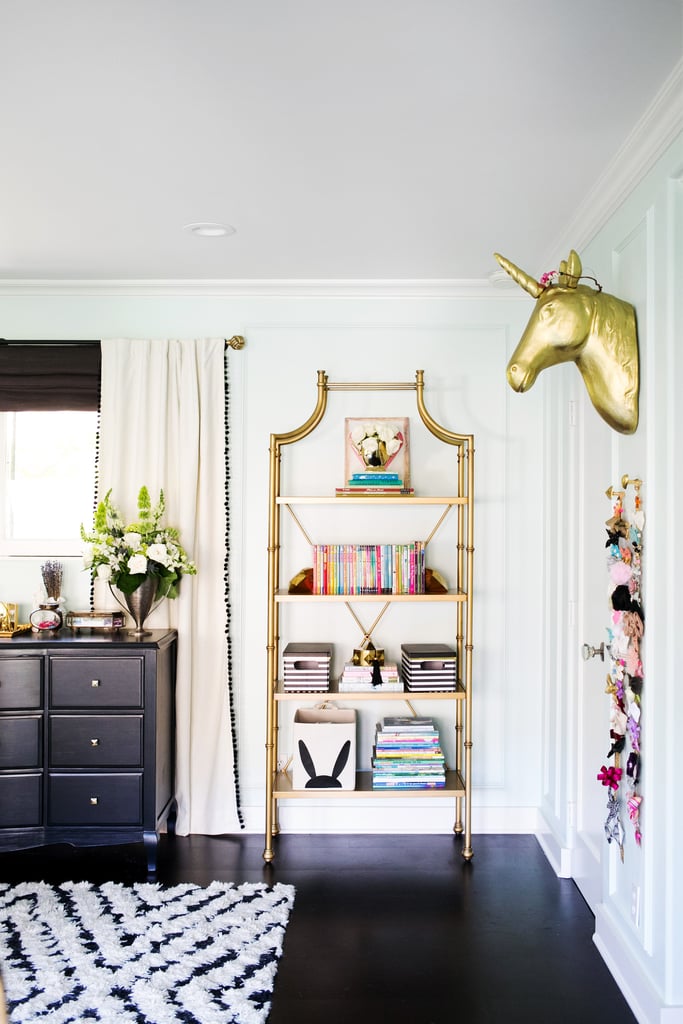 Tip 4: Organize for display

"A full-height bookcase, such as the Maison bookcase, will allow you to stay organized as well as maximize the vertical space in a room.  Alternate shelves of books – held in place with playful bookends – with printed or patterned boxes and baskets for stylish storage. Display your favorite memento on a stack of books to mix up heights, and encase both accessories and keepsakes in cloches and jewelry boxes."
