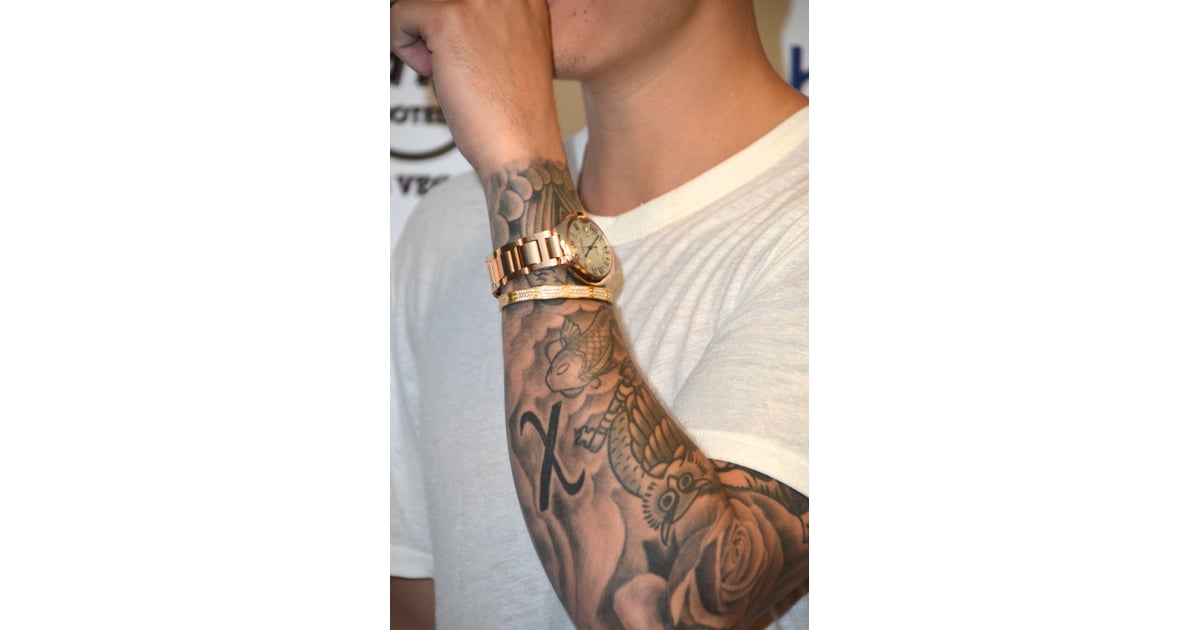 Justin has a bolded "X" on his left arm. | What Do Justin ...