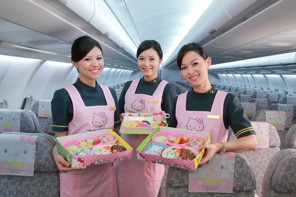 The flight crew aboard the Hello Kitty jet dons pink uniforms that feature the cute cartoon herself.