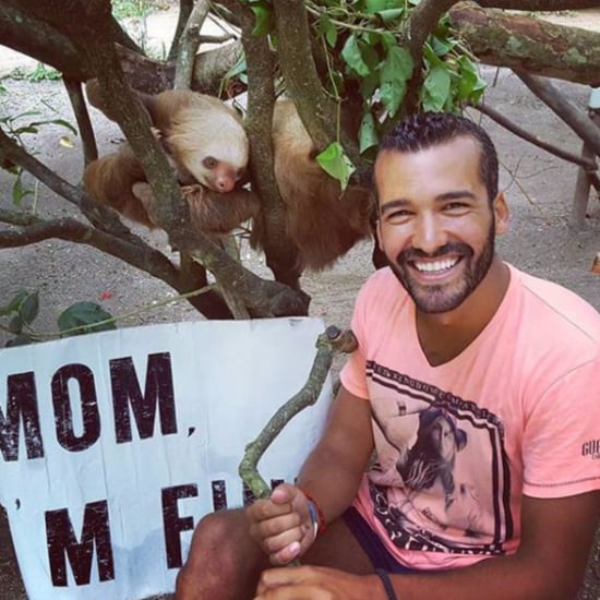 Guy Travels the World With "Mom I'm Fine" Sign