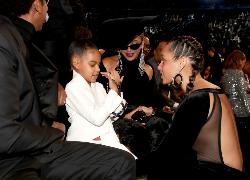 She also couldn't resist showing off her $2,675 heart-shaped Valentino clutch to Alicia Keys at the 2018 Grammys.