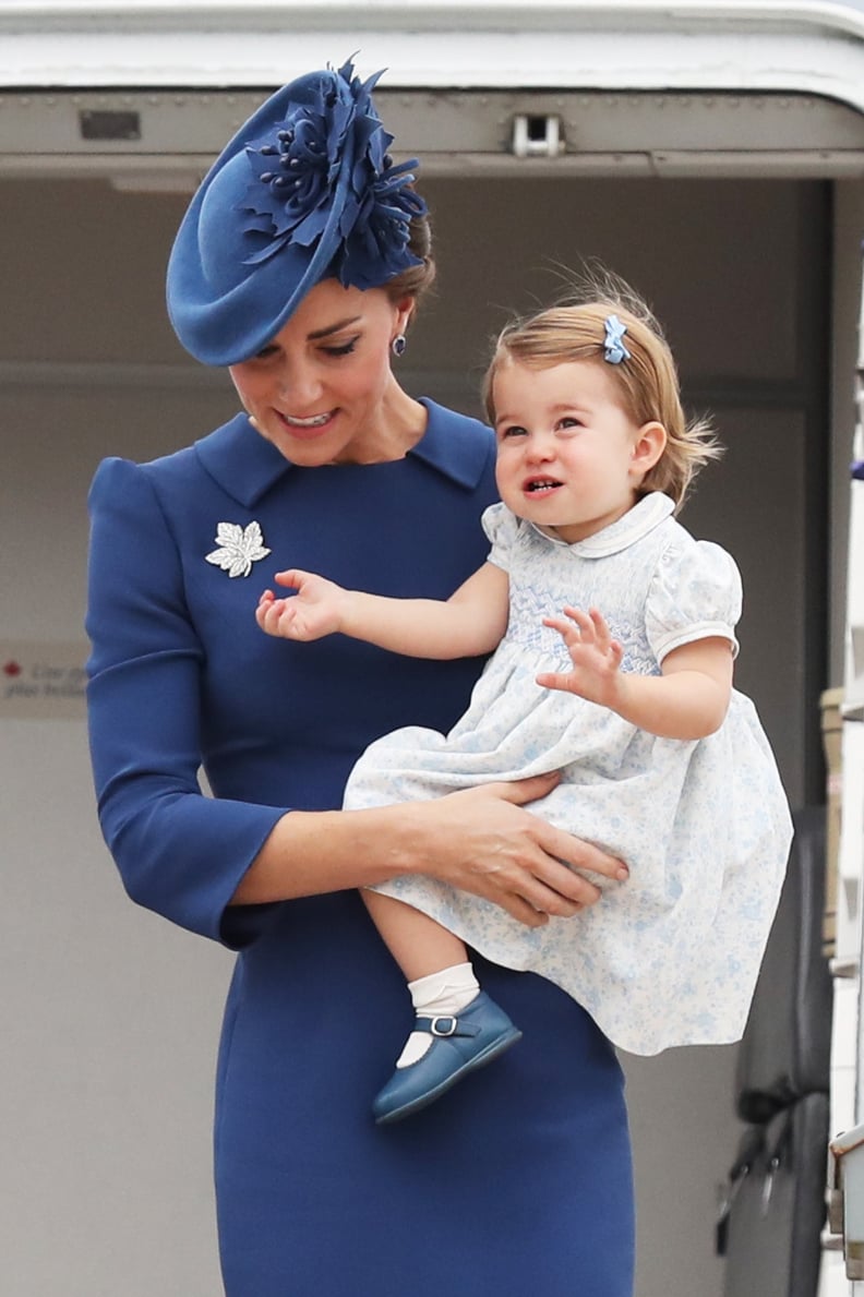 "I'm already a pro at this smiling and waving thing. Right, mom?"