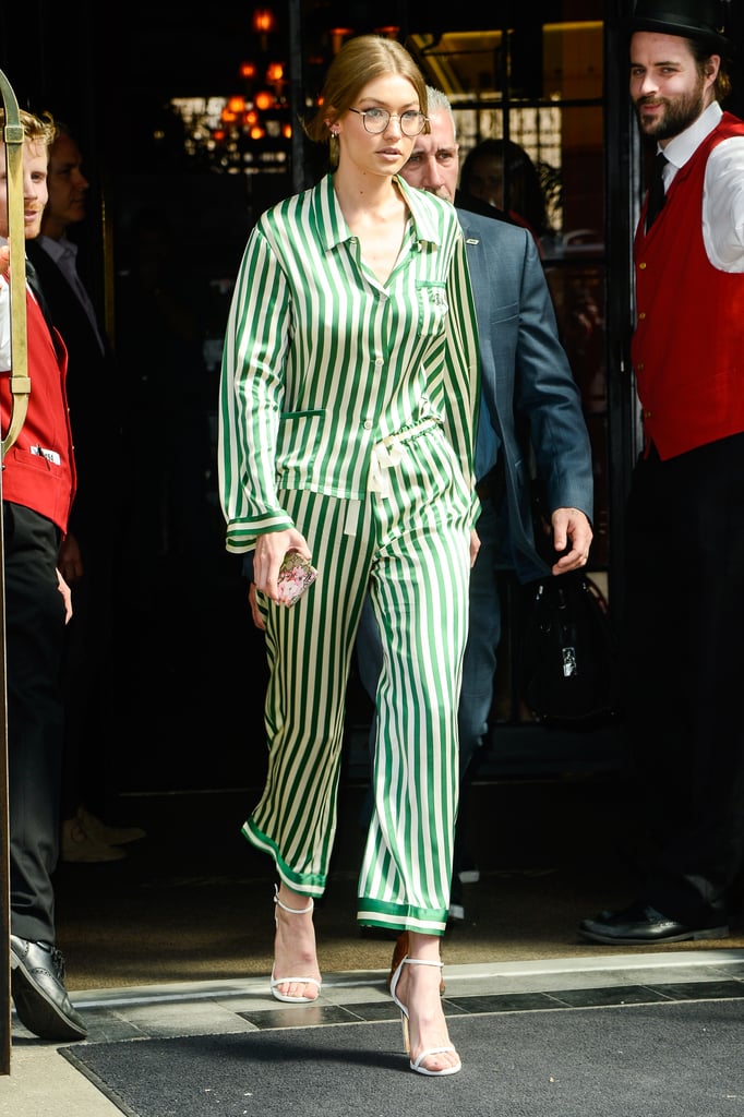 In striped silky pajamas, Gigi manages to keep her look elevated with a pair of ankle-strap stilettos.
In striped silky pajamas, Gigi manages to keep her look elevated with a pair of ankle-strap stilettos.