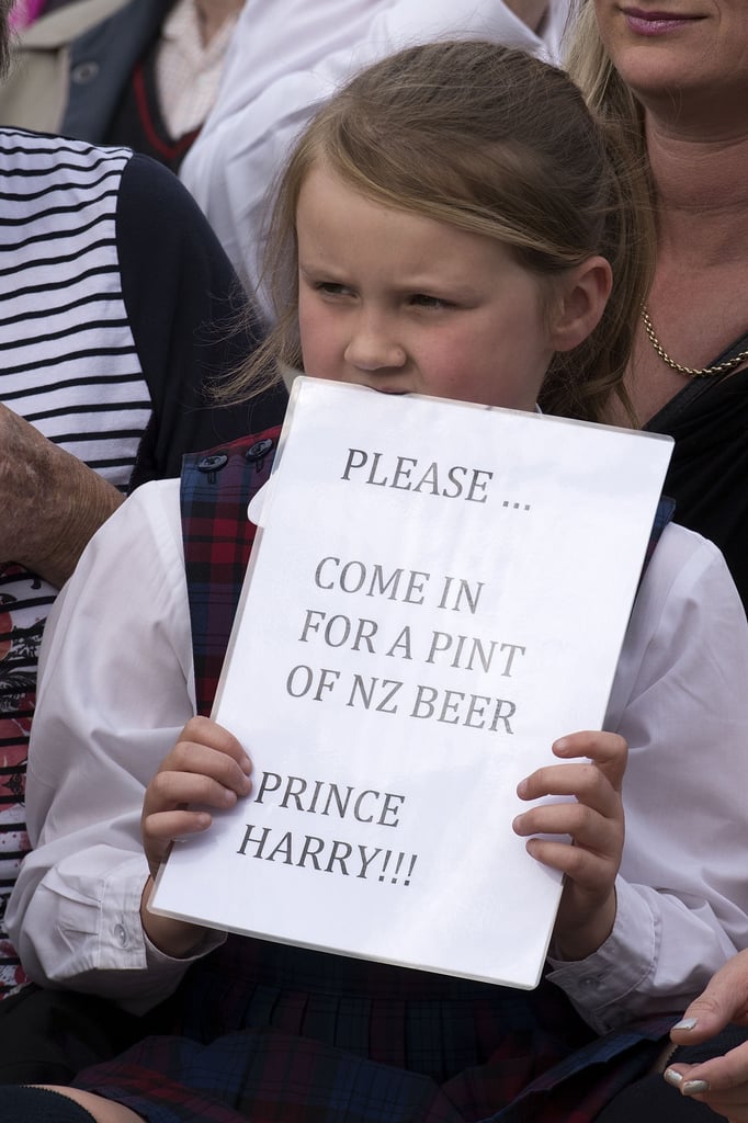 This little girl looks entirely too young to drink beer, but we love her spirit.