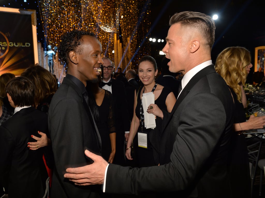 Brad Pitt chatted with Barkhad Abdi.