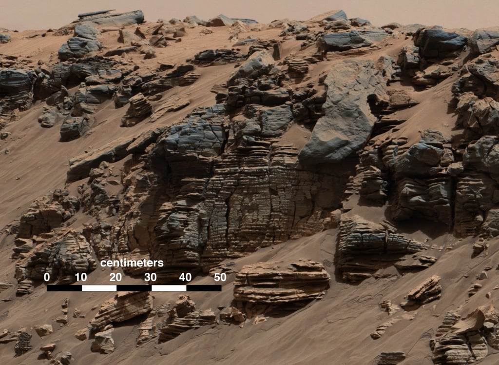 A photograph, taken by Curiosity, of the evenly layered rock on Mount Sharp, which looks similar to a lake-floor sedimentary deposit here on Earth.