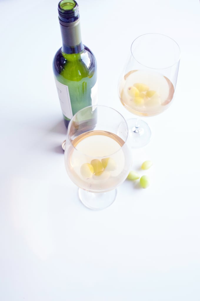 Freeze grapes for keeping wine cold.