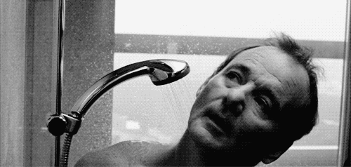 When he lowers his body to get the best possible shower.