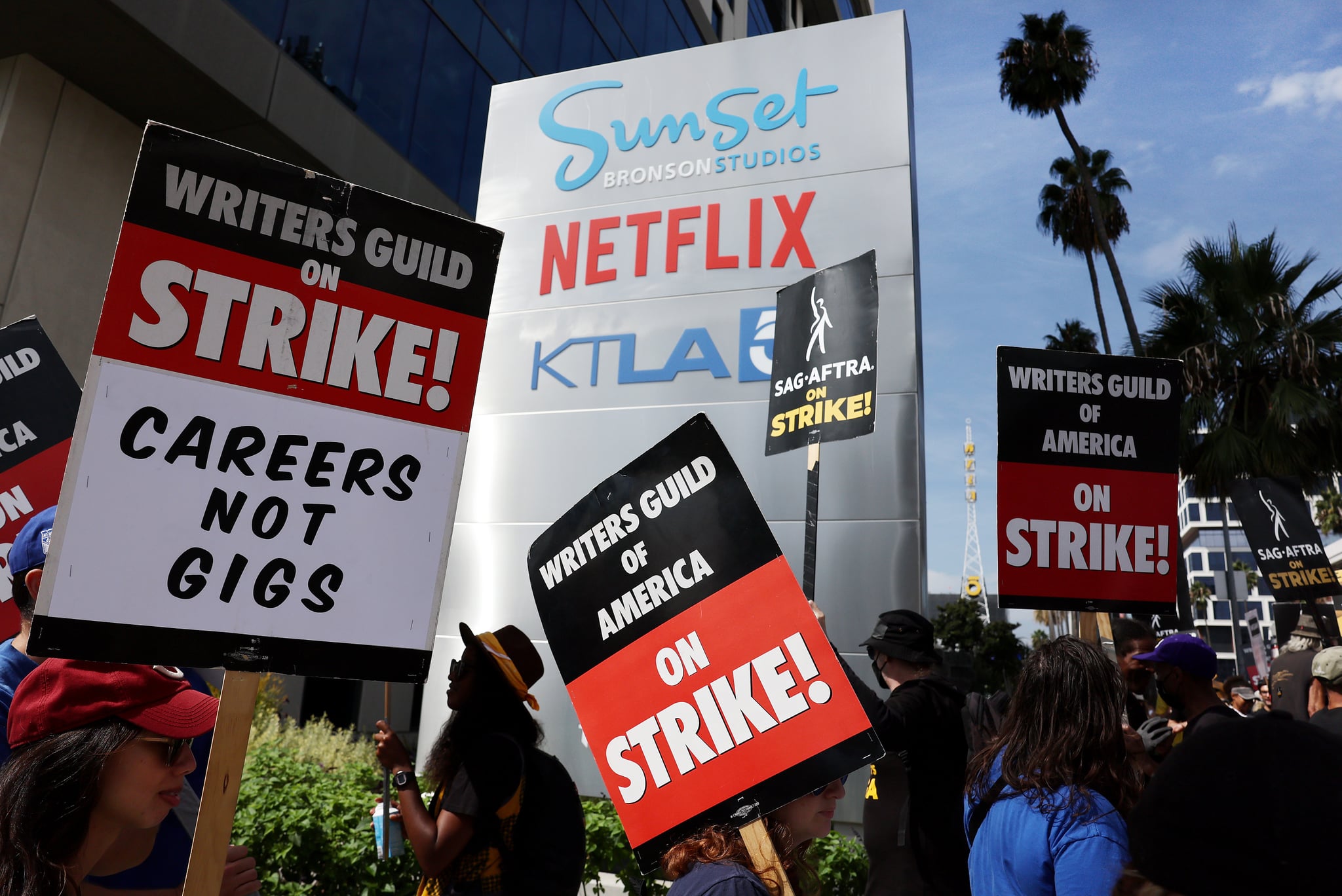 LOS ANGELES, CALIFORNIA - SEPTEMBER 22: Striking WGA (Writers Guild of America) members picket with striking SAG-AFTRA members outside Netflix studios on September 22, 2023 in Los Angeles, California. The Writers Guild of America and Alliance of Motion Picture and Television Producers (AMPTP) are reportedly meeting for a third straight day today in a new round of contract talks in the nearly five-months long writers strike.  (Photo by Mario Tama/Getty Images)