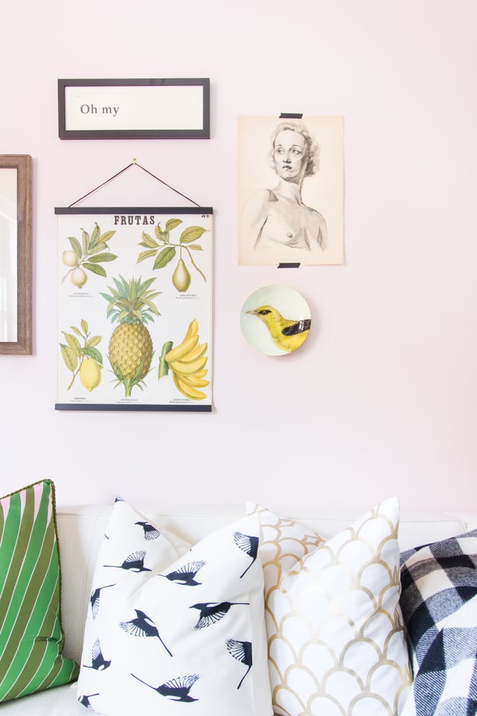 Instead of spending a fortune on fancy art, this homeowner got creative. She mounted a decorative plate, tapped a beautiful charcoal drawing (way cheaper than framing!) and hung a vintage school fruit chart.