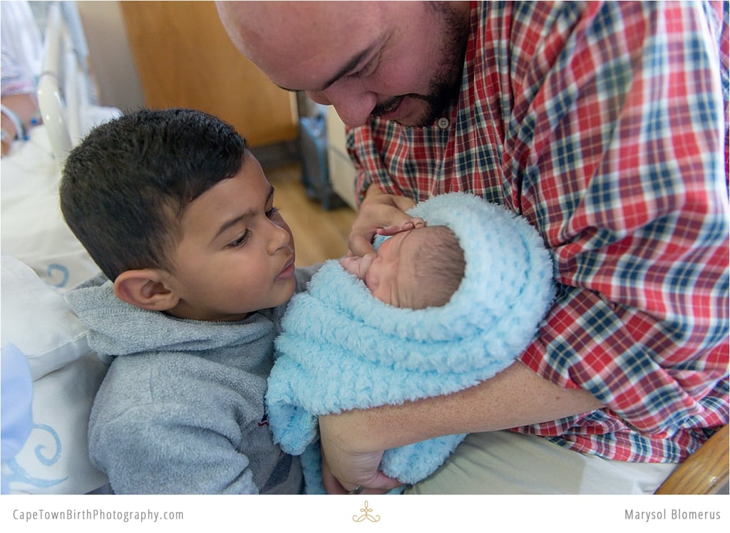 Birth Photos and Sibling Meeting Baby
