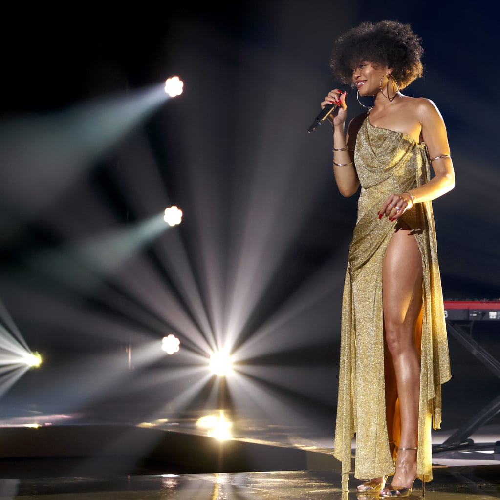 Andra Day Wears Gold Dress With Leg Slit to Essence Awards