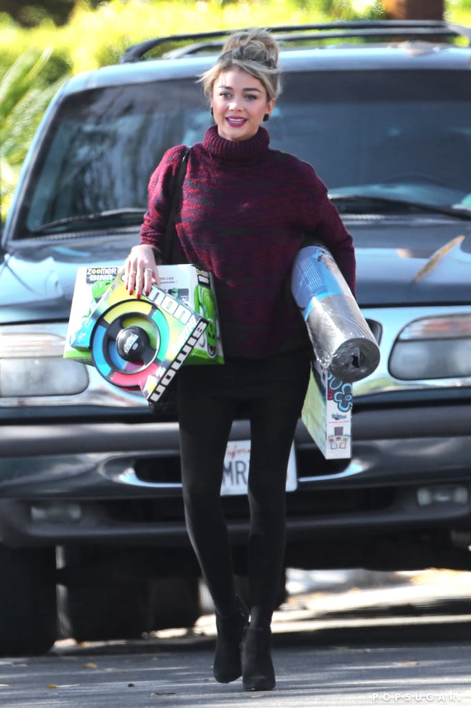 Sarah Hyland's hands were full in LA on Saturday.