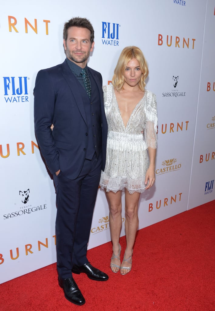Sienna posed on the Burnt red carpet next to costar Bradley Cooper.