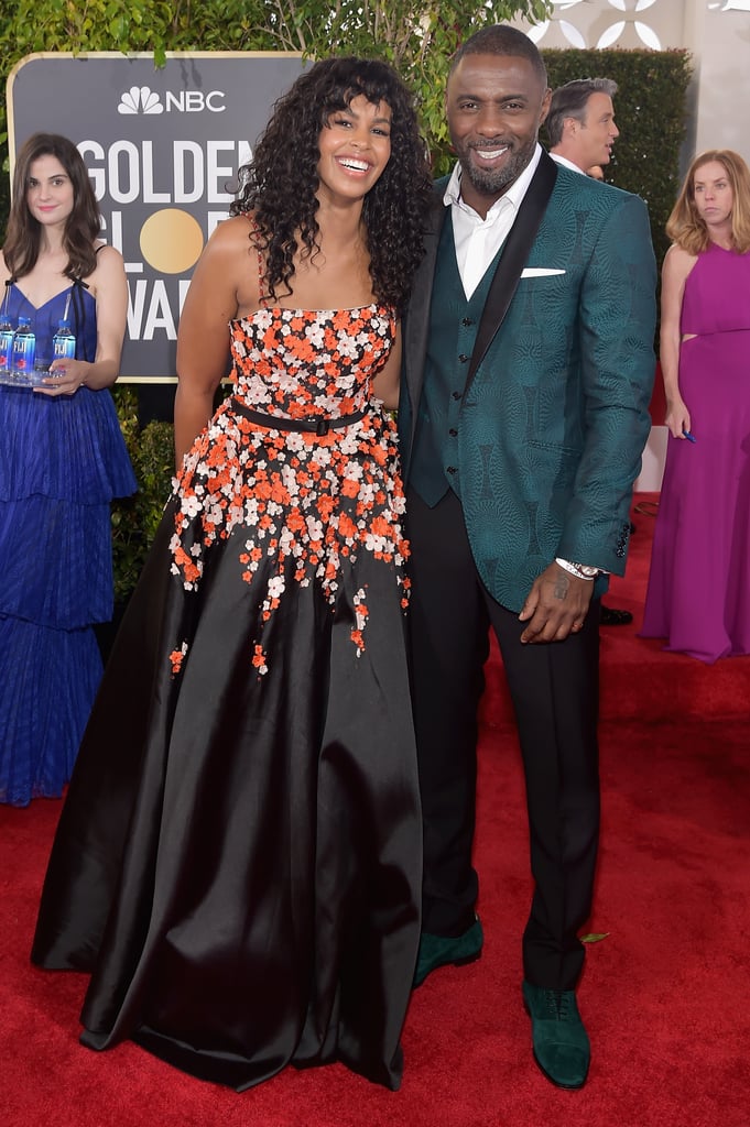 We can hardly blame her for trying to squeeze into this photo of Idris and his fiancée.